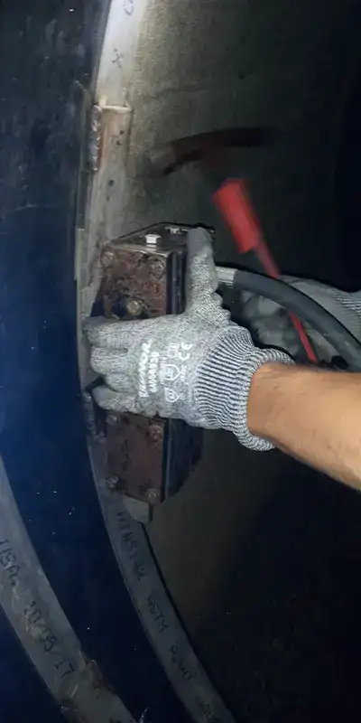 A technician positioning a hydraulic expander in the retaining band of a HydraTite seal
