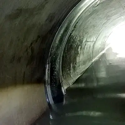 A circular pipe with heavy flow and a joint sealed with HydraTite