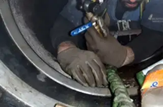 HydraTite being installed with three retaining bands in a small-diameter pipe