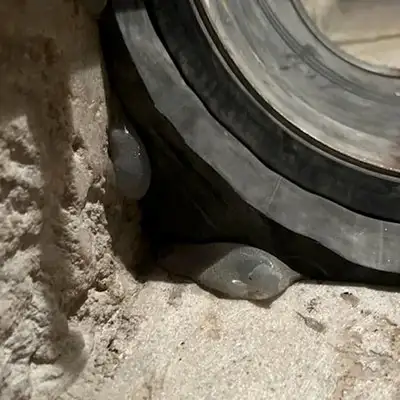 A corner of a box-shaped flume that has a HydraTite seal covering it
