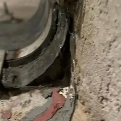 A corner of a box-shaped flume that has a HydraTite seal covering it