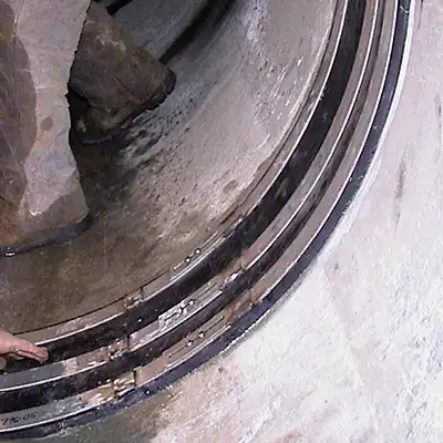 A HydraTite seal installed with three retaining bands over a joint in an air supply line pipe