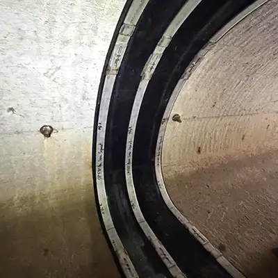 A HydraTite seal installed in an irregularly-shaped pipe