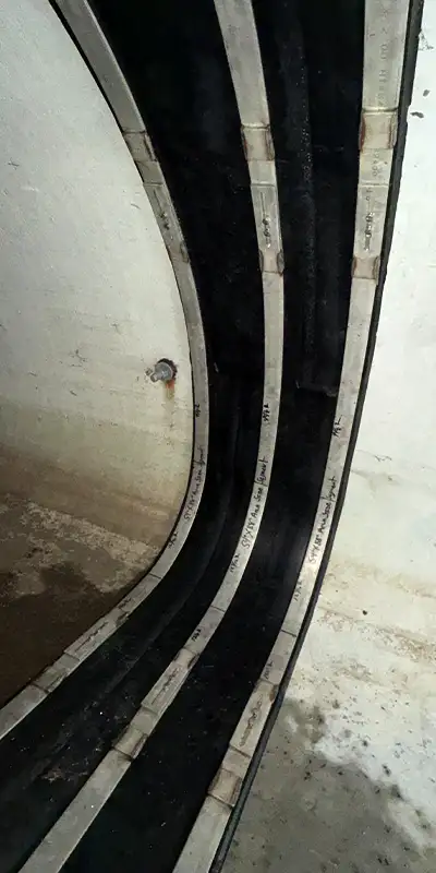 HydraTite installed in an irregularly-shaped pipe with three retaining bands