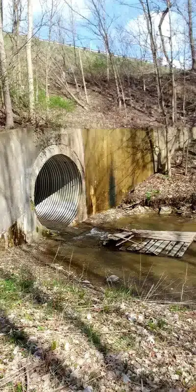 An entrance to a corrugated metal pipe