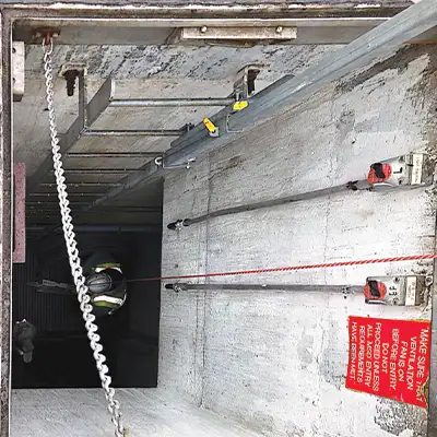A technician that has descended into a pipe