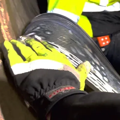 Lubricant being applied to the ribs of a HydraTite seal