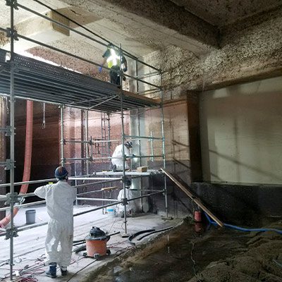 Technicians working on the inside of an expansion
