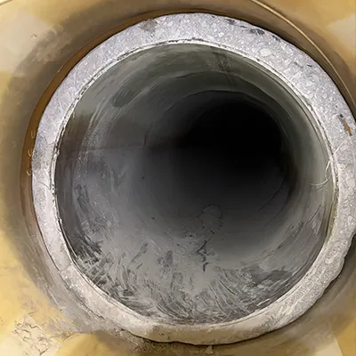 A pipe transition between a steel pipe to a lined concrete pipe