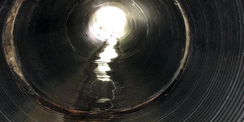 A corrugated metal pipe with a severely compromised joint