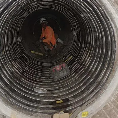 A long sleeve of HydraTite seals installed in an interlocking manner to cover a larger repair area in a pipe