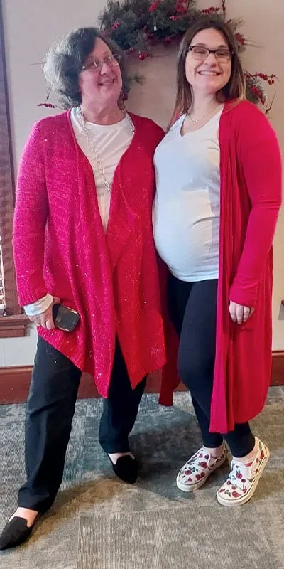 Two HydraTech employees standing together at the Christmas lunch