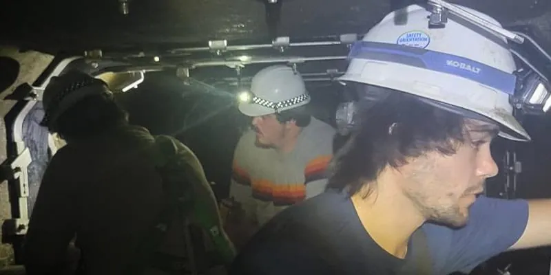 Several technicians sitting in a box-culvert installing HydraTite over joints