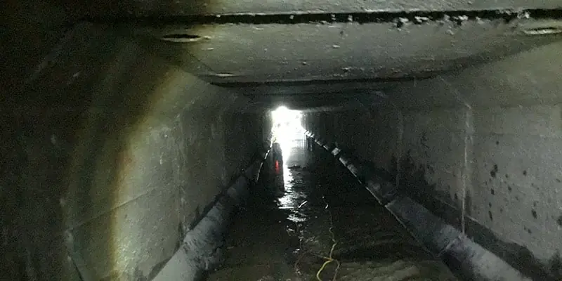 Looking down a long box culvert with light at the end