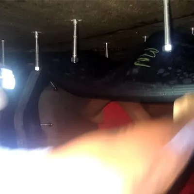 Rubber being positioned over a joint in an irregularly-shaped pipe