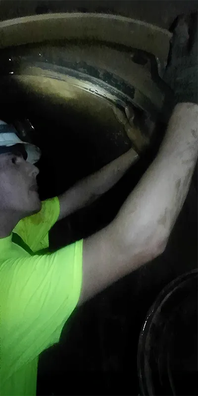 A field technician positioning the retaining bands in a HydraTite installation