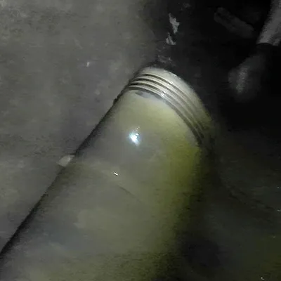 A rubber seal sitting on the invert of a pipe with the ribs of the rubber facing upwards