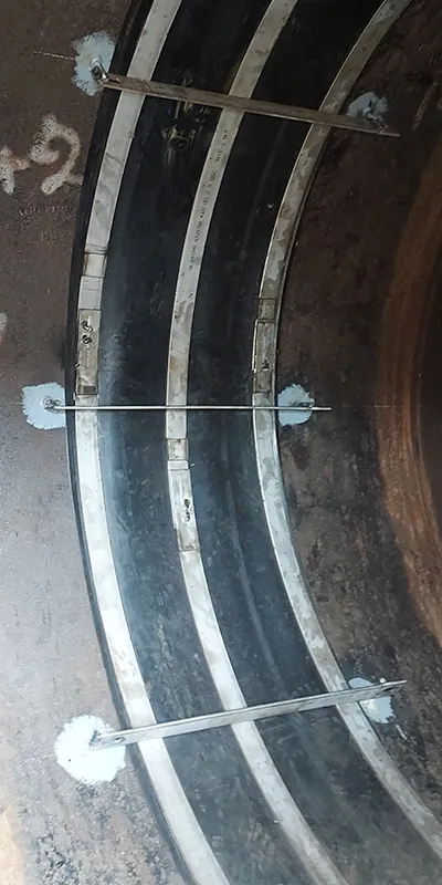 A couple of restraining braces installed atop a HydraTite seal