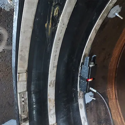Studs installed on either side of a HydraTite internal pipe joint seal that is installed atop a penstock pipe joint