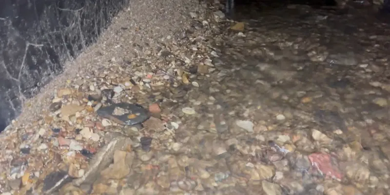 A lot of debris covering the invert of a pipe