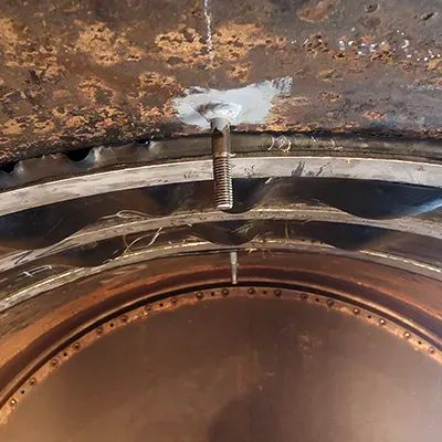 Studs installed on either side of a HydraTite internal pipe joint seal that is installed atop a penstock pipe joint
